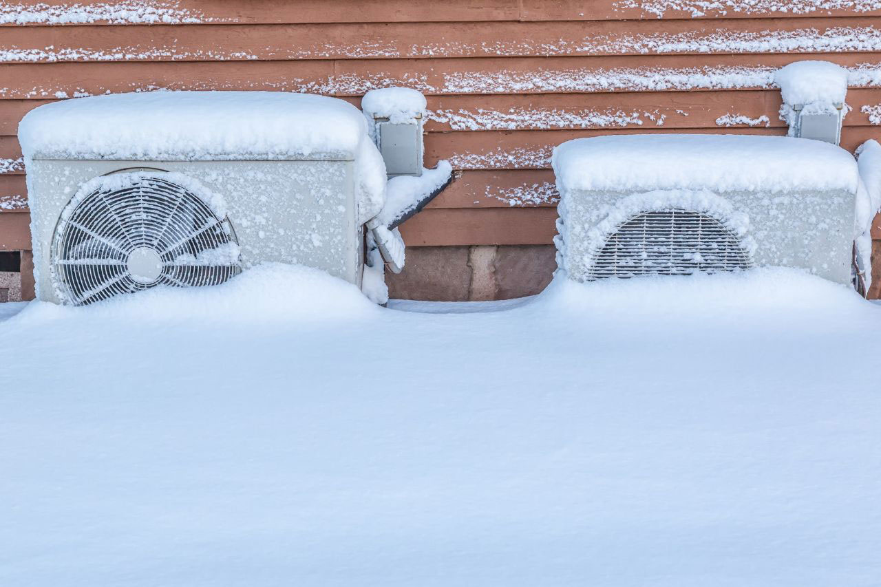 Residential heat pumps buried in snow