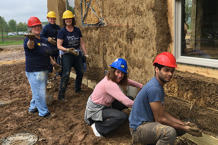 Volunteers building the strawbale house. Image courtesy of U-M Planet Blue Ambassadors